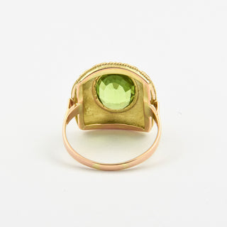 Ring aus Gelb- und Weißgold mit Peridot und Brillant