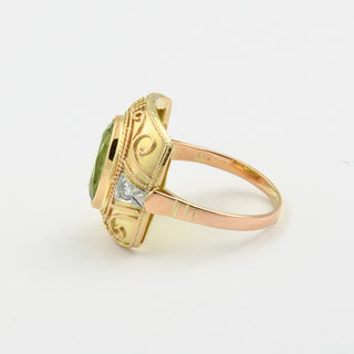 Ring aus Gelb- und Weißgold mit Peridot und Brillant