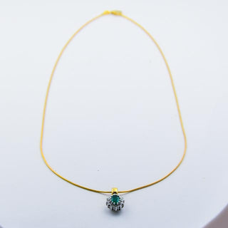 Christ Kette mit Smaragdanhänger aus Gelb- und Weißgold mit Brillant