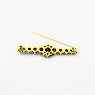 Granatbrosche aus 333 Gelbgold, nachhaltiger second hand Schmuck perfekt aufgearbeitet