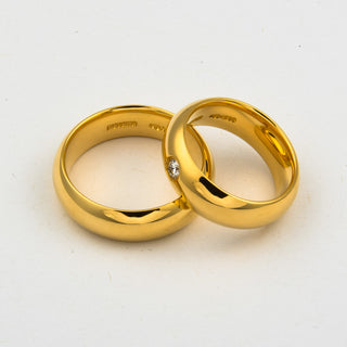 Niessing Trauringe halbrund/bombiert aus 750 Gelbgold mit Brillant, nachhaltiger second hand Schmuck perfekt aufgearbeitet