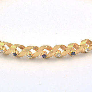 Brillantarmreif aus 585 Gold mit Saphir, nachhaltiger second hand Schmuck perfekt aufgearbeitet