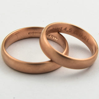 Niessing Trauringe gewölbt/bombiert aus 585 Rotgold mit Brillant, nachhaltiger second hand Schmuck perfekt aufgearbeitet