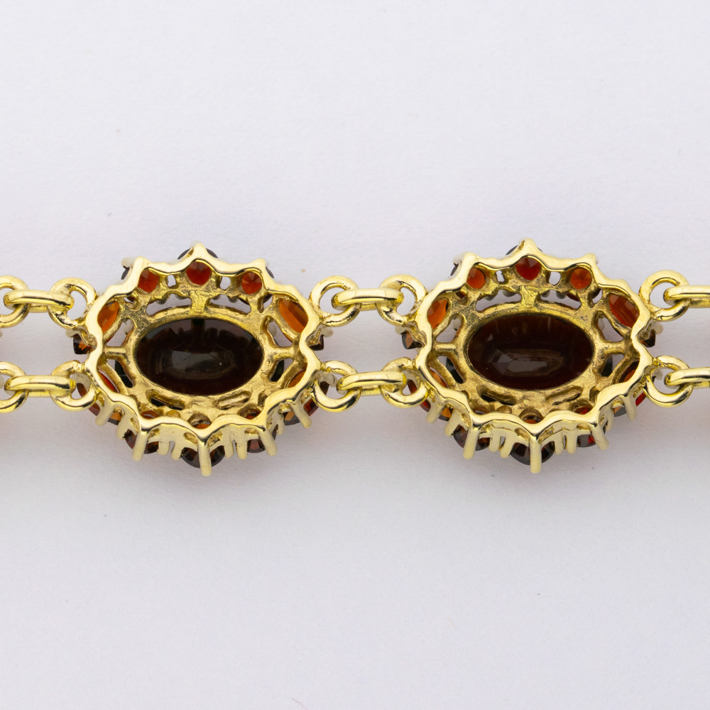 Armband aus 333 Gelbgold mit Granat, hochwertiger second hand Schmuck perfekt aufgearbeitet