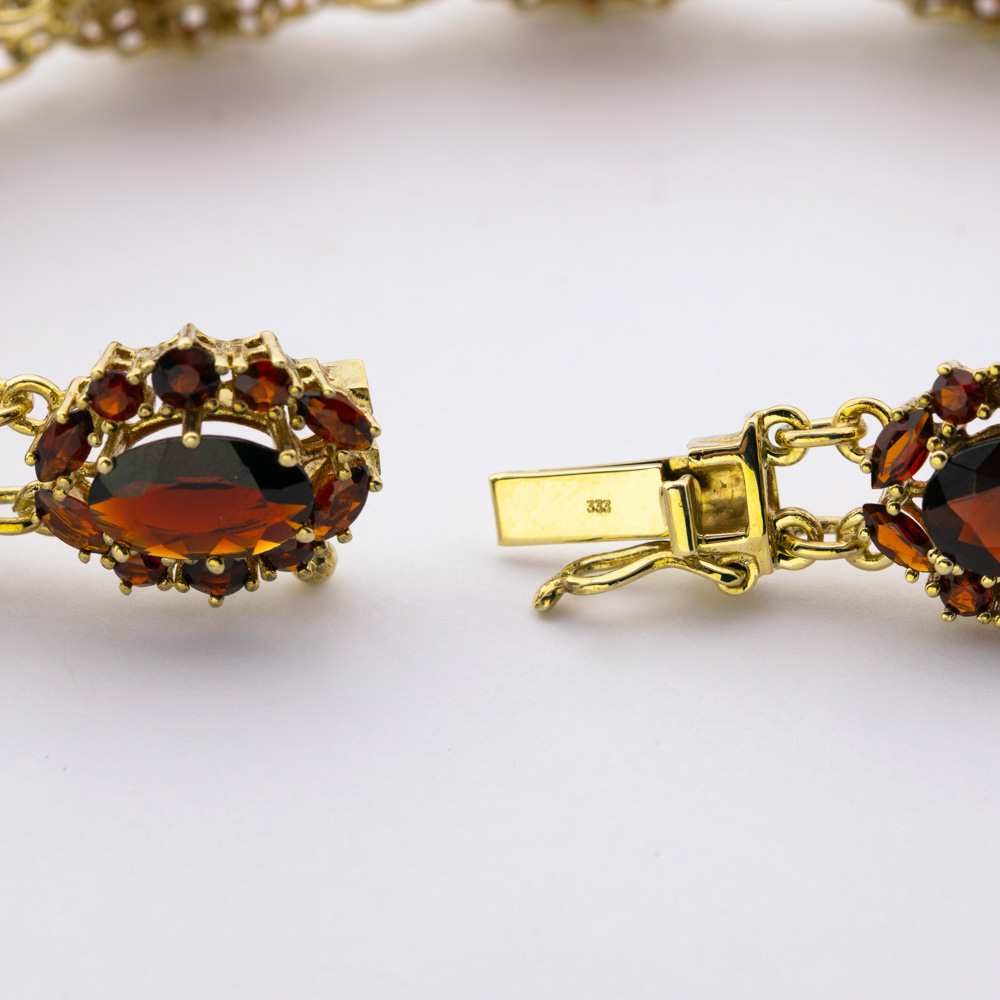 Armband aus 333 Gelbgold mit Granat, hochwertiger second hand Schmuck perfekt aufgearbeitet